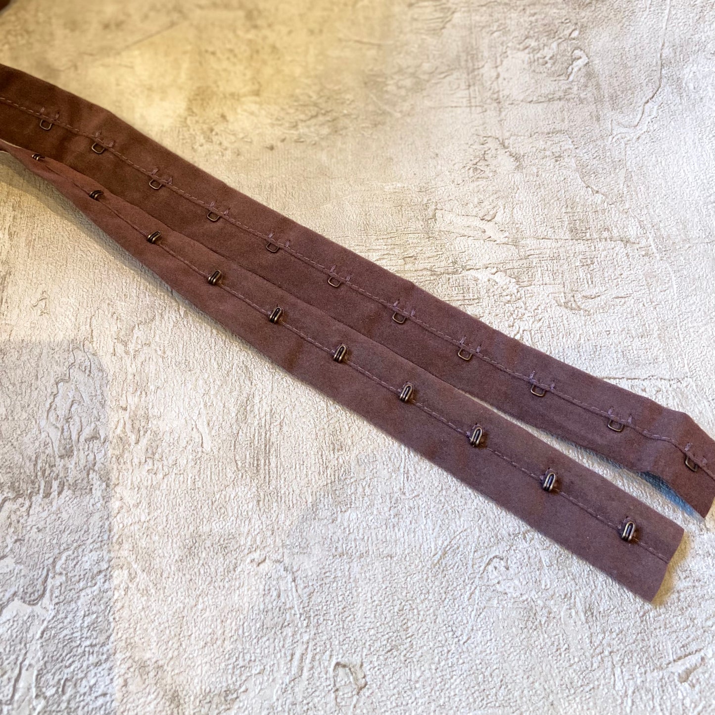 Miederband mit Oesen